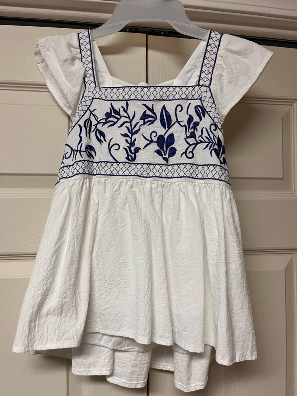 White Cap Sleeve tie-back shirt with Navy Blue Floral Embroidery